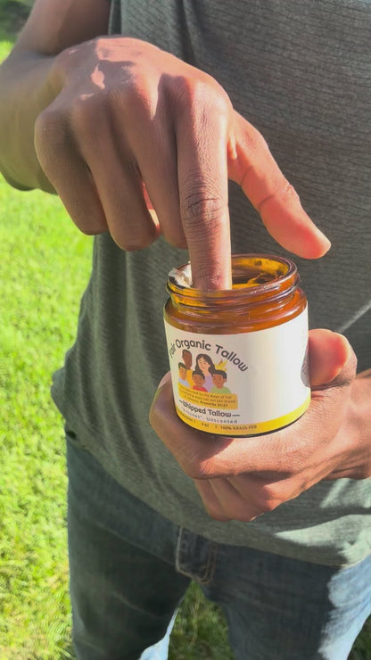 A small amount of Virtuous balm is scooped from the jar and massaged into a forearm.