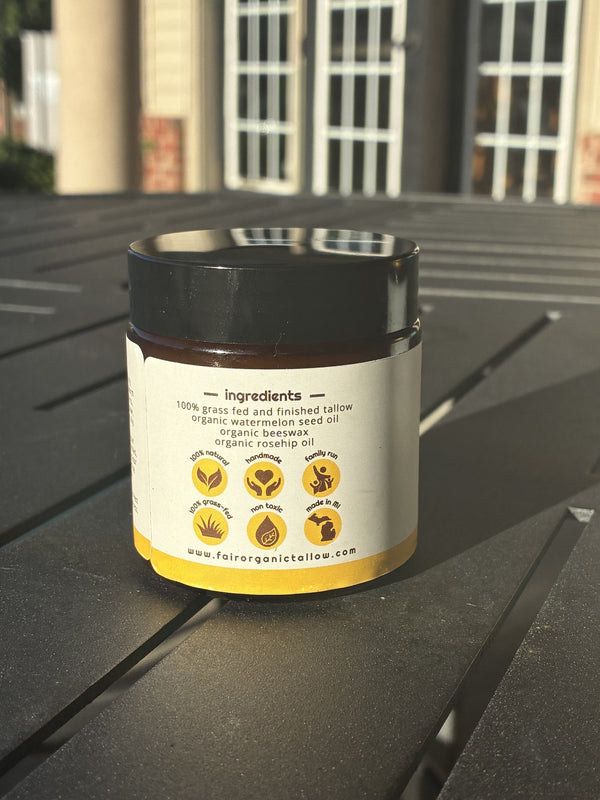The ingredients panel on a black-lid jar of Virtuous tallow balm.